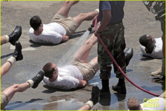 120165, AMERICAN FLASHER! Bradley Cooper rocks some very short shorts while filming a Navy Seals training scene for 'American Sniper' in Los Angeles. Cooper, who filmed with co-star and real-life Navy Seal Kevin Lacz, had to lay on the beach doing exercises, while being sprayed with a hose. Lacz was a Navy Seal teammate of Chris Kyle, who "American S&iper" is based nn, and was hired to play the role of himself after originally coming on as the technical advisor for the film. Clint Eastwood was also on hand to direct the scene. Los Angeles, California - Wednesday June 4, 2014. Photograph: KVS/Gaz Shirley, © PacificCoastNews. Los Angeles Office: +1 310.822.0419 London Office: +44 208.090.4079 sales@pacificcoastnews.com FEE MUST BE AGREED PRIOR TO USAGE